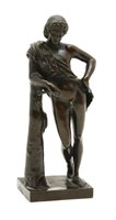 Lot 203 - A bronze youth leaning on a post, (arm broken)...