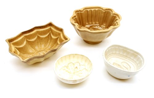 Lot 311 - Thirty pottery jelly moulds, including parrot,...