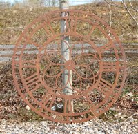 Lot 1058 - A pierced steel clock face with Roman numerals, 112 diameter