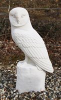 Lot 459 - A large reconstituted stone sculpture of a barn owl