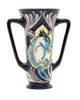 Lot 249 - A modern Moorcroft twin handled vase, decorated with a stylised squirrel