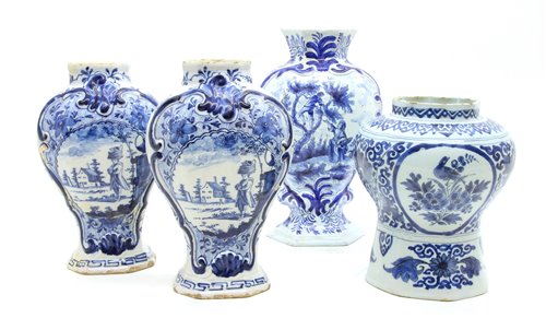 Lot 325 - Four Dutch Delft blue and white vases, two with signed bases, tallest 26.5cm
