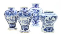 Lot 325 - Four Dutch Delft blue and white vases, two with signed bases, tallest 26.5cm