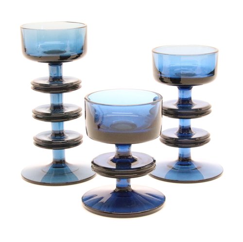 Lot 239 - A set of three blue glass Sheringham candleholders, designed by Ronald Stennett-Wilson for Wedgwood