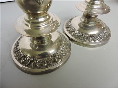 Lot 4 - Two pairs Thai silver candlesticks and a box