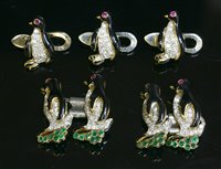 Lot 206 - A Continental two colour gold, diamond, emerald and enamel novelty penguin cufflink set