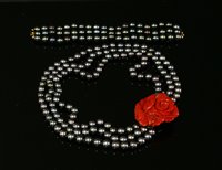 Lot 311 - A French three row cultured pearl and coral necklace and bracelet suite