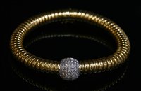 Lot 413 - A Continental two colour gold diamond set gas pipe or tubogas bracelet