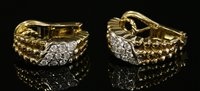 Lot 497 - A pair of gold diamond set half hoop earrings