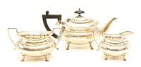 Lot 198 - A George V silver batchelor's three piece tea set of faceted form and on short hoof feet