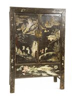 Lot 621 - A Chinese lacquered cabinet