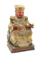 Lot 371 - A Chinese polychrome decorated carved wooden figure