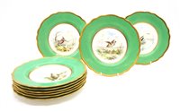 Lot 132 - A set of 12 Wedgwood porcelain dessert plates decorated with game birds, 23 cm diameter
