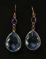 Lot 428 - A pair of gold blue topaz and sapphire drop earrings