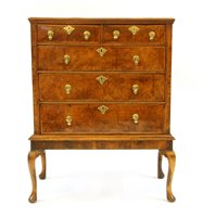 Lot 690 - A Queen Anne walnut chest on stand with two short and three graduated long drawers