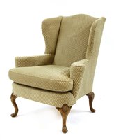 Lot 731 - A George II-style wing armchair