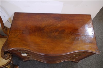 Lot 655 - A George III mahogany serpentine commode chest