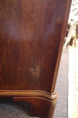 Lot 655 - A George III mahogany serpentine commode chest