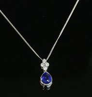 Lot 505 - An 18ct white gold sapphire and diamond pendant