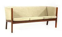 Lot 464 - An oak three seater sofa