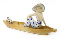 Lot 79 - A Goldscheider figure of a woman sitting in a boat with a terrier