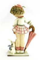 Lot 112 - A Goldscheider craft pottery figure of a girl holding an umbrella
