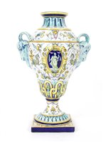 Lot 442 - An Italian majolica twin handled urn vase