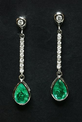 Lot 353 - A pair of 18ct white gold emerald and diamond drop earrings
