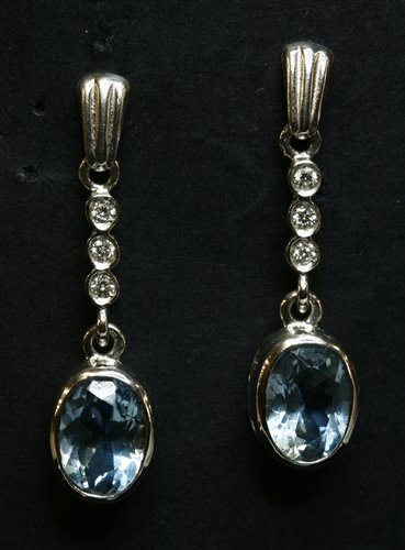 Lot 431 - A pair of 18ct white gold aquamarine and diamond drop earrings