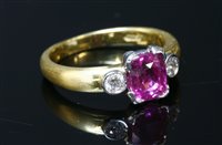 Lot 470 - An 18ct yellow and white gold pink sapphire and diamond three stone ring