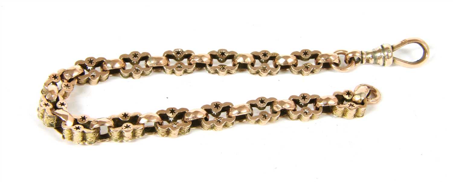 Lot 13 - A gold fancy faceted belcher and pierced link bracelet