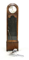 Lot 795A - An Art Deco oak long case clock