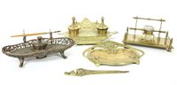 Lot 548 - Four brass inkstands