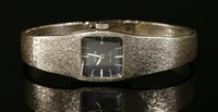 Lot 631 - A ladies 18ct white gold Omega de Ville mechanical bracelet watch, c.1970