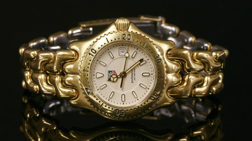 Lot 618 A ladies gold plated Tag Heuer Professional