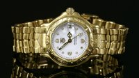 Lot 626 - A ladies' 18ct gold Tag Heuer Automatic bracelet watch