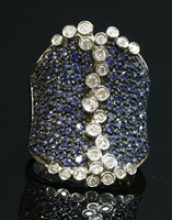 Lot 290 - A Continental white gold diamond and sapphire saddle ring