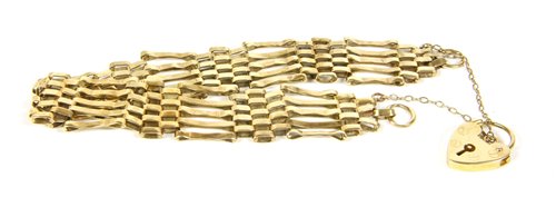 Lot 266 - A 9ct gold five row gate link bracelet with padlock