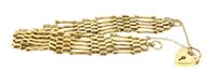 Lot 266 - A 9ct gold five row gate link bracelet with padlock