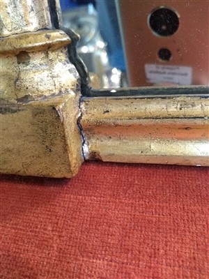 Lot 540 - A Regency giltwood and verre églomisé mirror