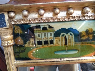 Lot 540 - A Regency giltwood and verre églomisé mirror