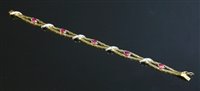 Lot 377 - An 18ct gold ruby and diamond bracelet
