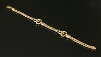 Lot 391 - An 18ct two colour gold hollow curb link bracelet