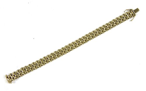 Lot 262 - A 9ct gold four row fancy link bracelet