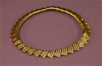 Lot 406 - An 18ct gold diamond set collar