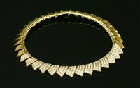 Lot 406 - An 18ct gold diamond set collar