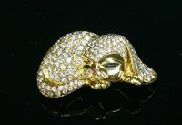 Lot 415 - A gold diamond set novelty puppy brooch, attributed to David Morris