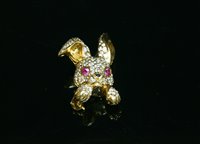 Lot 490 - An 18ct gold ruby and diamond novelty rabbit brooch, by David Morris