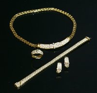 Lot 489 - An 18ct gold diamond set jarretière necklace, bracelet, earring and ring suite
