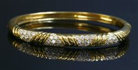 Lot 495 - An 18ct gold diamond set bangle